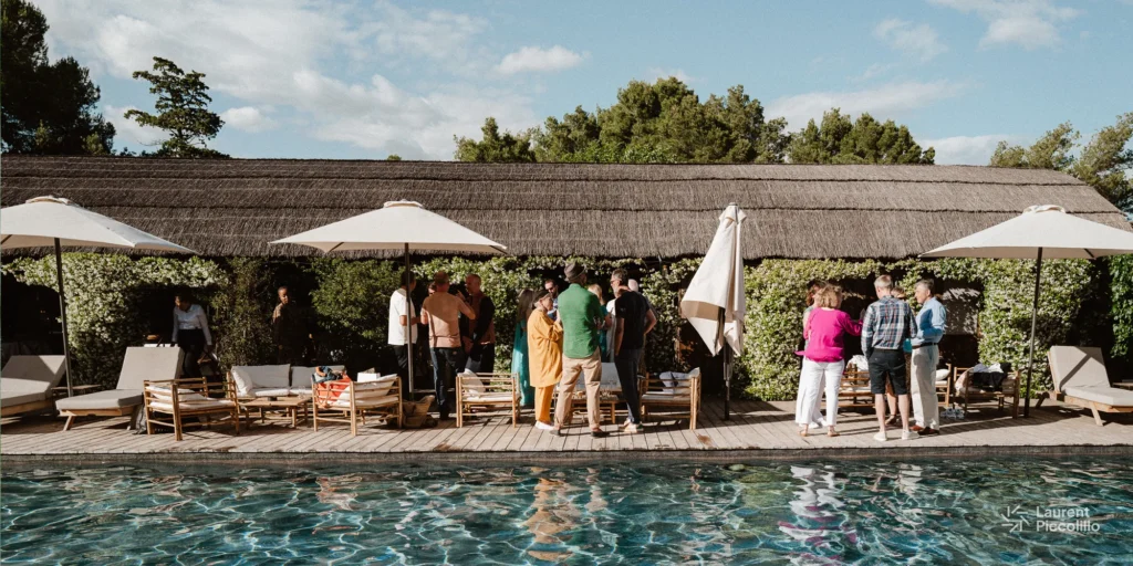 tarbouriech wedding accommodation and pool. Guests mingling during a relaxed multi-day French wedding getaway by the pool.