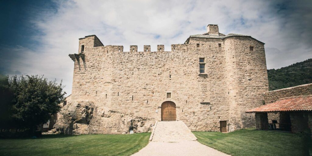 French summer wedding. historic venue with thick stone walls to keep naturally cool